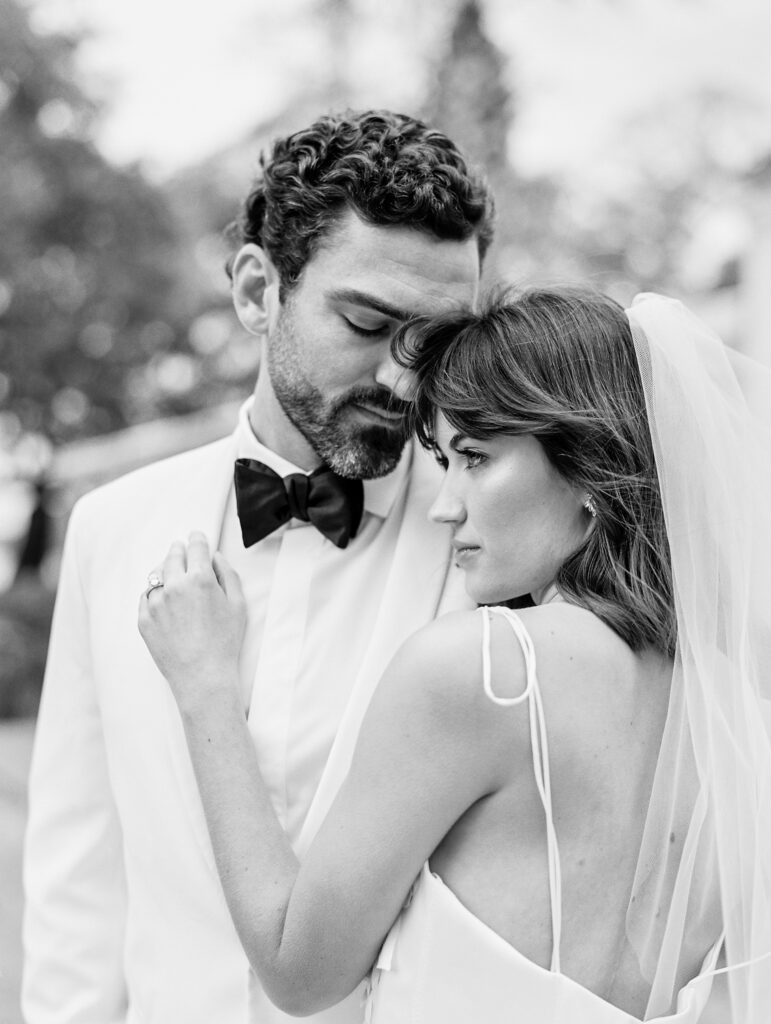 bride and groom in black and white at luxury charleston wedding
