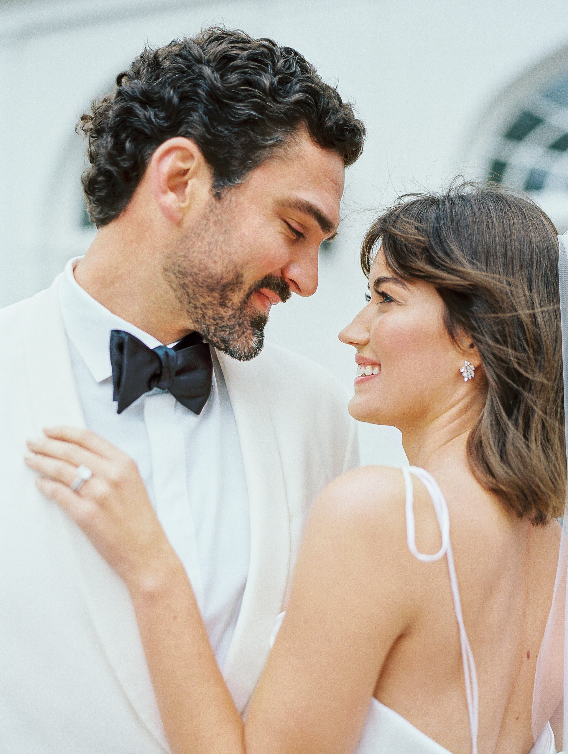 Lowdnes Grove Wedding by destination film wedding photographer Katie Trauffer Photography - bride and groom embrance
