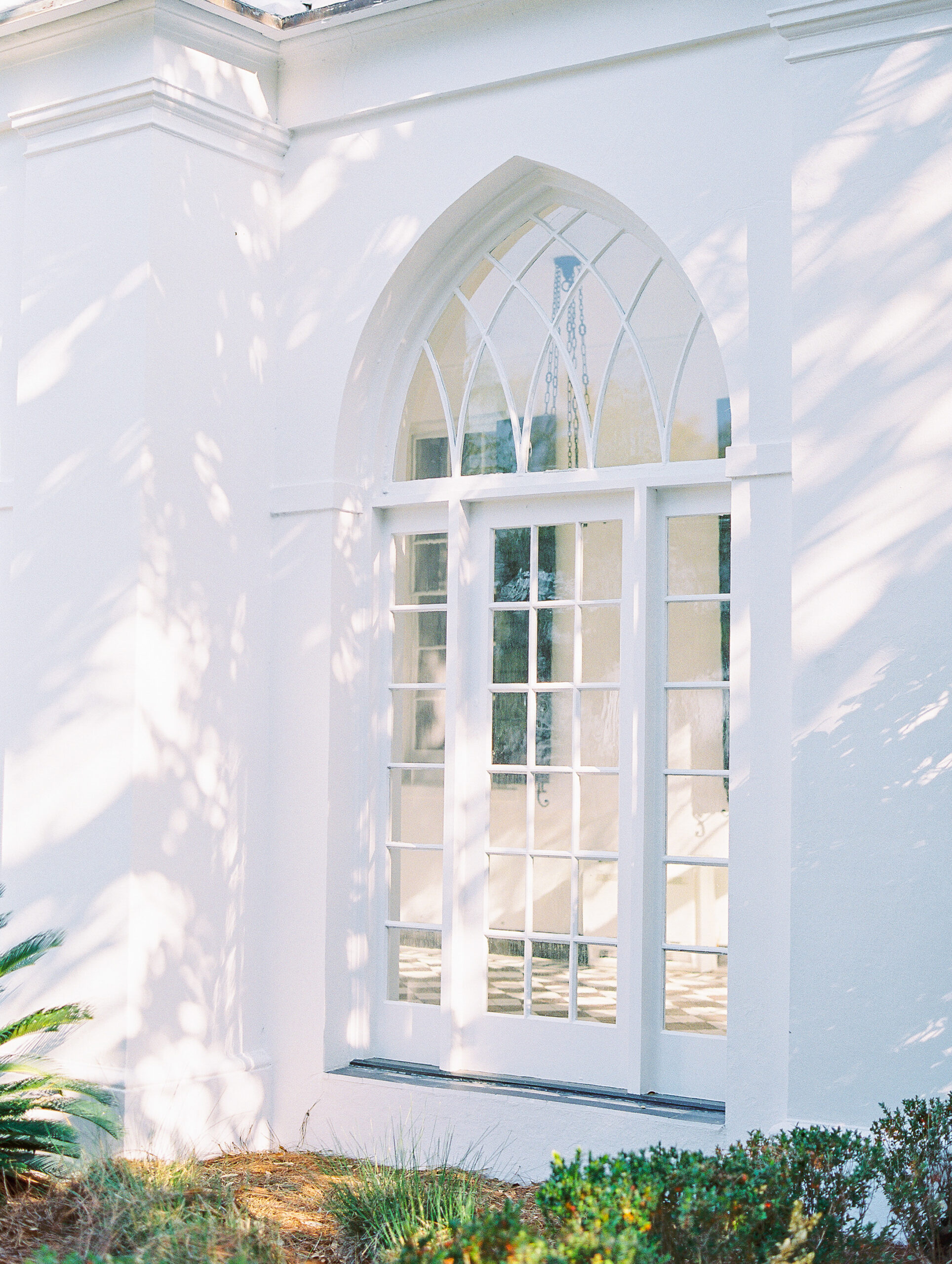 dappled sunlight on windows at charleston luxury wedding