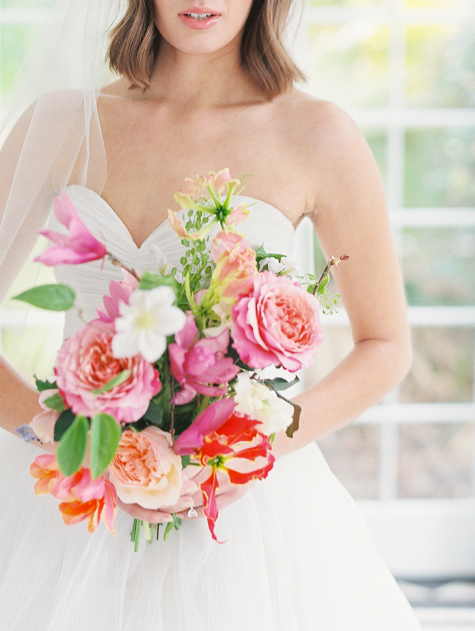 close up detail of jungle inspired bridal bouquet at luxury charleston wedding