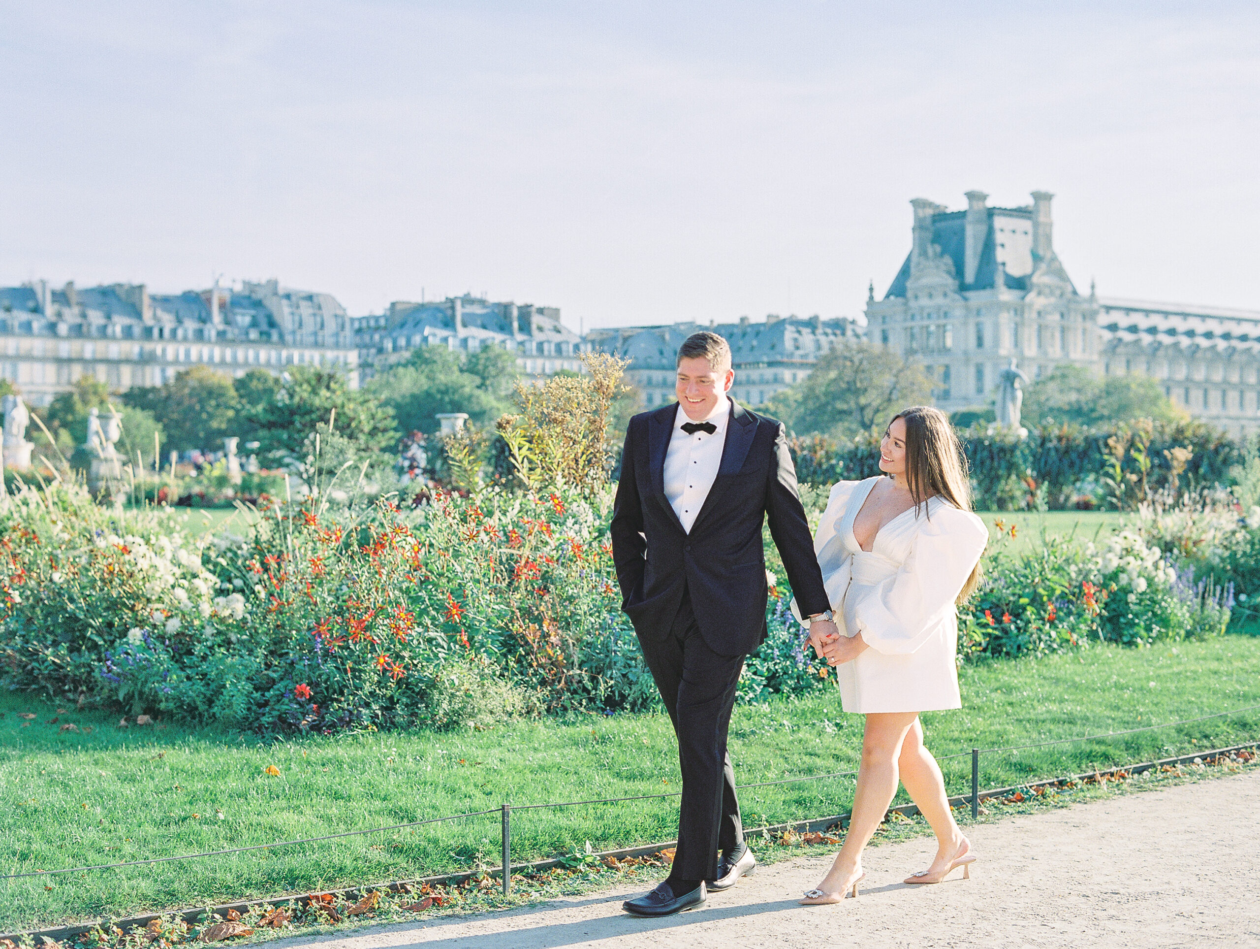 couple strolls through tuileries garden wedding day