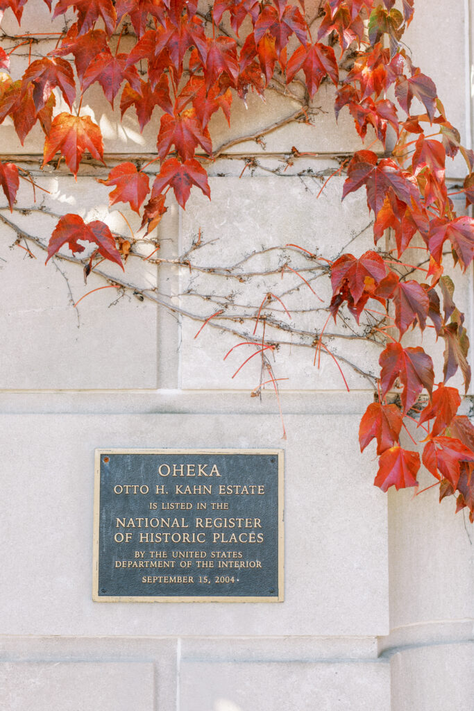 oheka castle sign surrounded by red ivy leaves