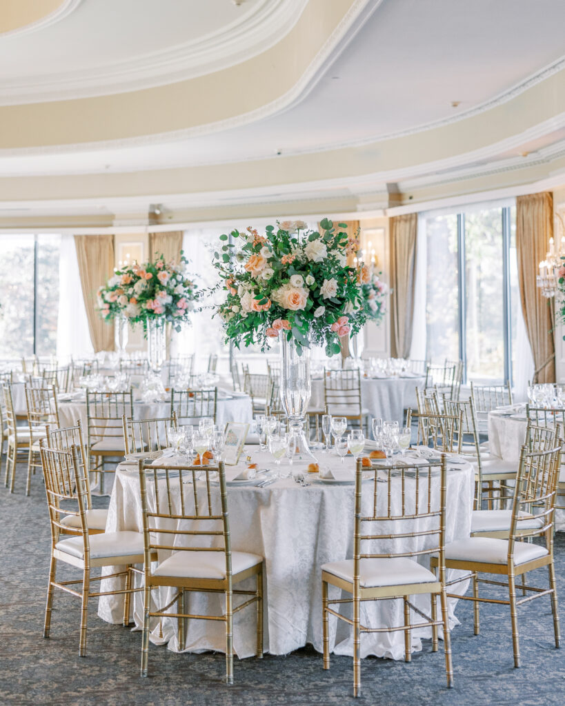 wedding ballroom at oheka castle with tall floral arrangements