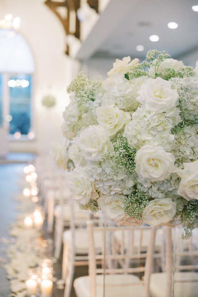 white and gold wedding chapel floral arrangement