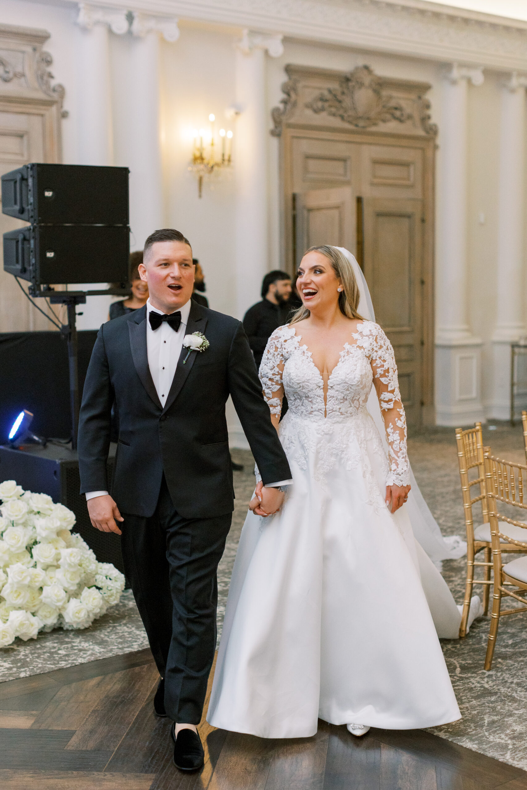 bride and groom enter grand ballroom with joy and excitement