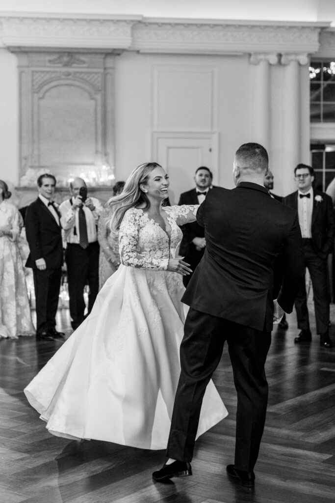 bride spins joyfully in elegant first dance