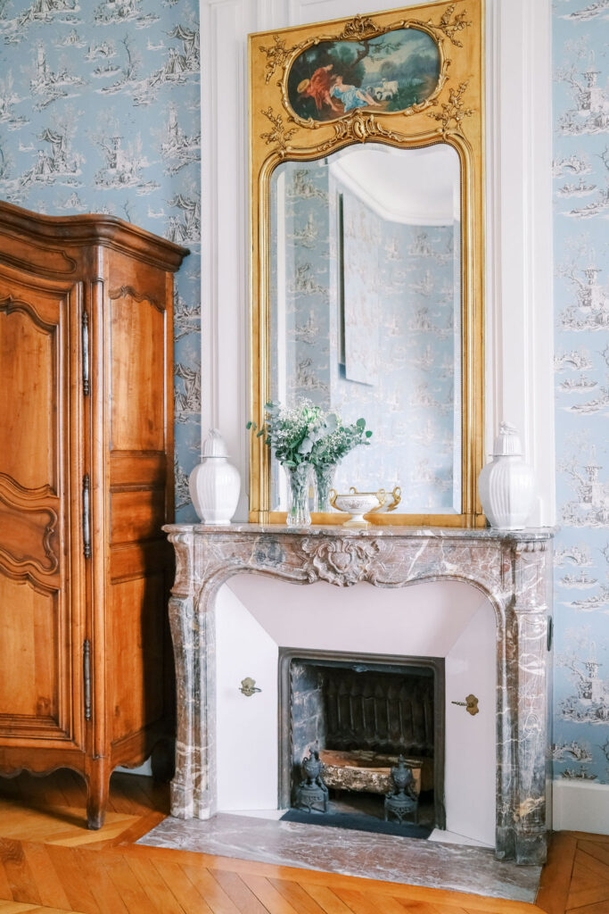 marble fireplace in guest room at Chateau du Grand Luce 