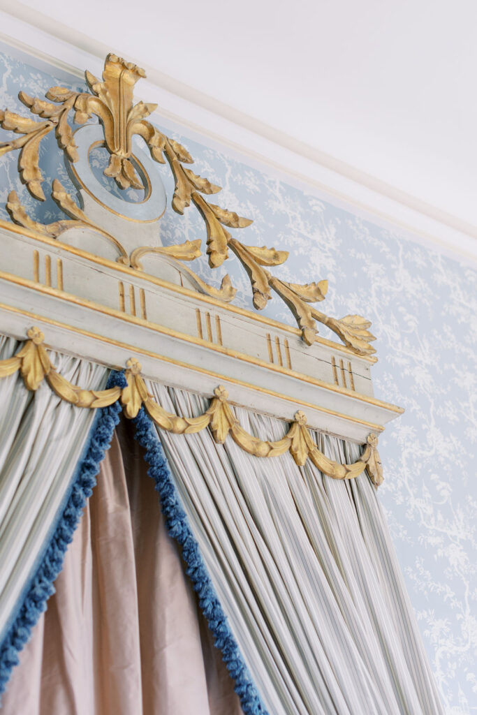 ornate gold and pink bed in Chateau du Grand Luce blue bedroom