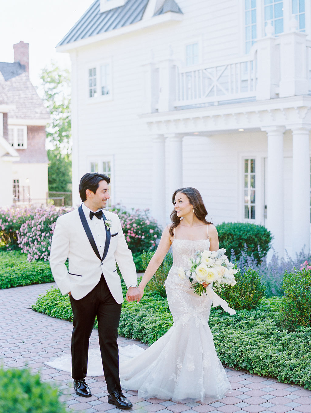 Romantic Ryland Inn Wedding Bride and Groom Walking through Gardens