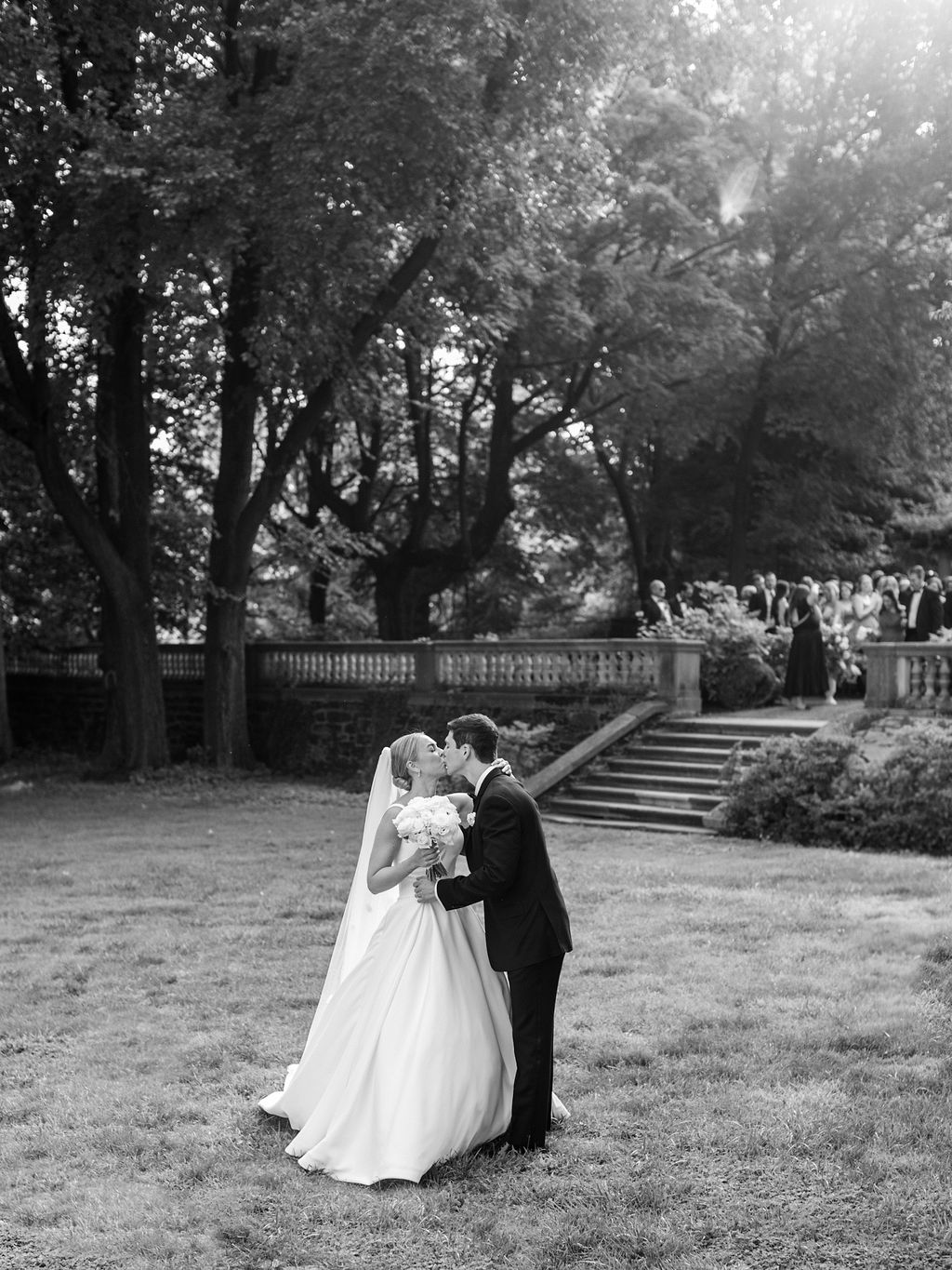 Curtis Hall Arboretum bride and groom kiss in the aisle