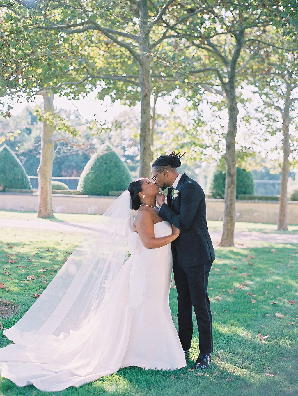 bride and groom in the garden Oheka Castle Wedding Photography