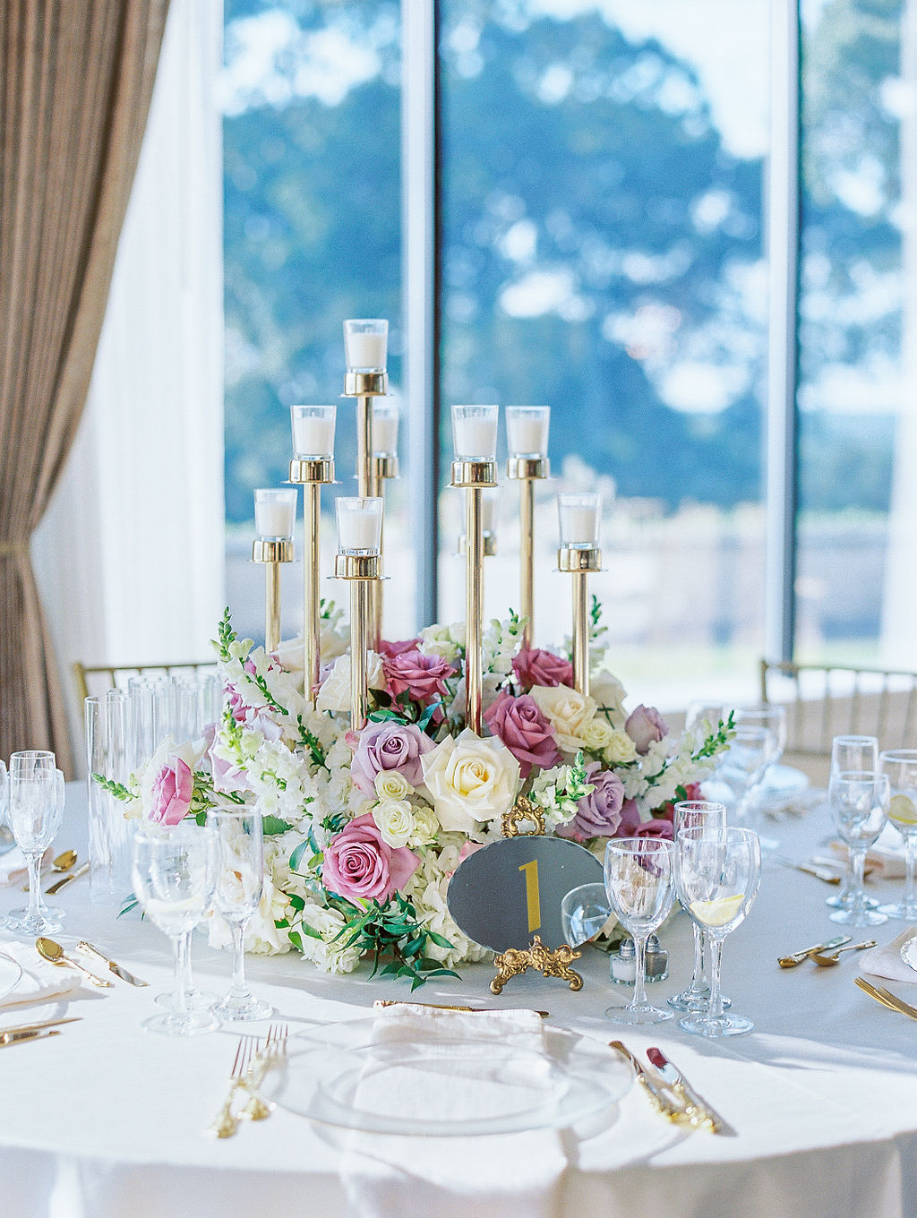 Oheka Castle Wedding Photography reception table with lush romantic rose floral arrangements