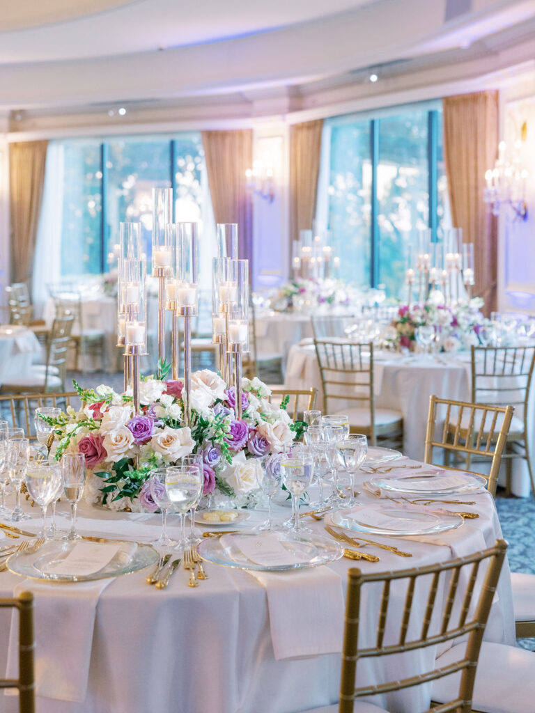 oheka wedding reception ballroom tables covered in candles and roses